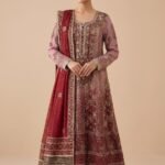 A regal crimson bridal with intricate antique gold craftsmanship