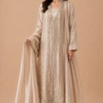 Champagne gold tissue ensemble by designer Bisma Amir