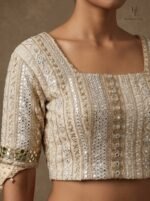 Chikankari blouse paired with a fluid champagne-gold lehenga - Image 3