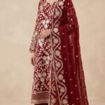 Deep crimson ensemble adorned with exquisite handcrafted gota work - full view