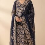 Navy blue formal by Roohèrang featuring intricate silver-gold floral embroidery on a rich sheer fabric